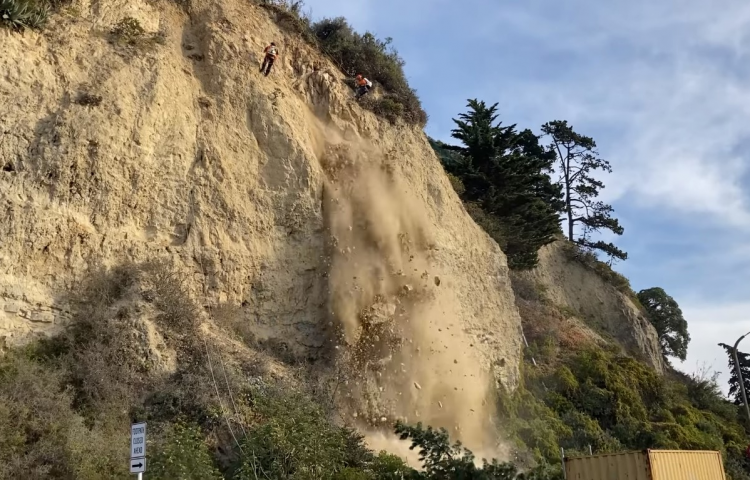Abseilers remove more than 50 tonnes of rock from Bluff Hill