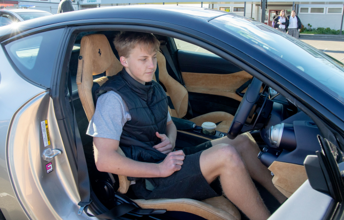Student celebrates restricted license with spin behind wheel of Ferrari